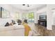 Open-concept living room with hardwood floors, neutral walls and a ceiling fan at 6152 Topsail Rd, Lady Lake, FL 32159