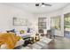 Open-concept living room featuring modern decor and hardwood floors at 6152 Topsail Rd, Lady Lake, FL 32159