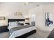 A main bedroom boasts neutral colors, carpet flooring, and views to the bathroom at 6152 Topsail Rd, Lady Lake, FL 32159