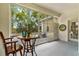 Charming enclosed patio with lots of natural light and seating options, ideal for entertaining or relaxing at 6152 Topsail Rd, Lady Lake, FL 32159