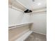 A walk-in closet with built-in shelving and storage space ready for organization at 6152 Topsail Rd, Lady Lake, FL 32159