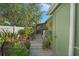 Charming backyard featuring a wooden walkway and patio adorned with potted plants at 628 Mount Homer Rd # 4B, Eustis, FL 32726