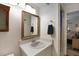 Bright bathroom with a sink, mirror, and towel rack at 628 Mount Homer Rd # 4B, Eustis, FL 32726