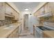 Functional kitchen with wood cabinets, modern appliances, and a stylish backsplash at 628 Mount Homer Rd # 4B, Eustis, FL 32726