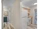 Efficient kitchenette with white appliances, wood cabinets, and attractive flooring at 628 Mount Homer Rd # 4B, Eustis, FL 32726
