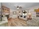 Bright living room with wood floors, brick fireplace, and comfortable seating at 628 Mount Homer Rd # 4B, Eustis, FL 32726