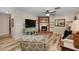 Inviting living room with brick fireplace, ceiling fan, and a comfortable seating area at 628 Mount Homer Rd # 4B, Eustis, FL 32726