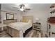 Comfortable main bedroom with a ceiling fan, dresser, and decorative accents at 628 Mount Homer Rd # 4B, Eustis, FL 32726