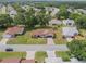 Aerial view of home with manicured lawn and landscaping, highlighted with a red outline at 6410 Tildon Ct, Leesburg, FL 34748