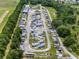 Wide aerial view showcasing a well-organized RV and boat storage facility with lush greenery at 6410 Tildon Ct, Leesburg, FL 34748