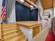 Spacious auditorium featuring a large stage, wooden accents, and an American flag, ideal for performances at 6410 Tildon Ct, Leesburg, FL 34748
