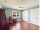 The bedroom features stylish laminate flooring, a window view, and closet space at 6410 Tildon Ct, Leesburg, FL 34748