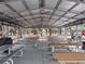 Inviting interior showcasing picnic tables, ceiling fans and ample space for gatherings within a shaded shelter at 6410 Tildon Ct, Leesburg, FL 34748