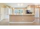 Well-equipped kitchen features a breakfast bar, modern appliances, and ample cabinet space for storage at 6410 Tildon Ct, Leesburg, FL 34748