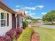 Attractive landscaping showcasing vibrant plants and manicured lawn, adding to the home's curb appeal at 6410 Tildon Ct, Leesburg, FL 34748