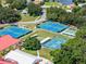 Aerial view of multiple tennis and pickleball courts offering residents a variety of options for outdoor recreation at 6410 Tildon Ct, Leesburg, FL 34748