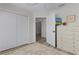 Spacious bedroom with large closet, ceiling fan, wood floors, and white dresser at 6444 Mcknight Loop, The Villages, FL 34762