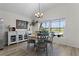 Cozy dining area with views of the outdoor patio and spa offers a relaxing setting for meals at 6444 Mcknight Loop, The Villages, FL 34762