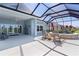 Covered patio featuring an outdoor fountain, ceiling fan, and seating at 6444 Mcknight Loop, The Villages, FL 34762
