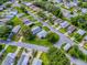 Discover this community from above, with cozy homes nestled among lush greenery at 701 Cottage Park Ln, Leesburg, FL 34748