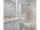 Clean bathroom featuring a vanity with granite counter, toilet and bathtub with shower at 701 Cottage Park Ln, Leesburg, FL 34748