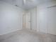 Neutral bedroom offering a closet with sliding doors at 701 Cottage Park Ln, Leesburg, FL 34748