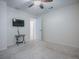 An inviting bedroom with a ceiling fan and a door that leads to another room at 701 Cottage Park Ln, Leesburg, FL 34748