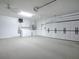 Garage with laundry area, storage cabinets, and side-mounted garage door opener at 701 Cottage Park Ln, Leesburg, FL 34748
