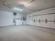 This roomy garage contains laundry equipment and plenty of storage at 701 Cottage Park Ln, Leesburg, FL 34748