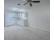 Bright eat-in kitchen with white cabinets and appliances, creating a clean and inviting space at 701 Cottage Park Ln, Leesburg, FL 34748