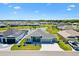 Well-maintained single Gathering home with a landscaped front yard and picturesque pond view at 7250 Trundle Ter, The Villages, FL 34762
