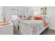 Charming bedroom featuring two twin beds, bright natural light, and tasteful coastal decor at 7250 Trundle Ter, The Villages, FL 34762