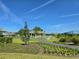Scenic view of a gazebo set amidst lush greenery, offering a peaceful community gathering space at 7250 Trundle Ter, The Villages, FL 34762
