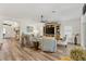 Spacious living room featuring vaulted ceilings, hardwood flooring, and neutral tones, perfect for comfortable living at 7250 Trundle Ter, The Villages, FL 34762