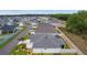 Back aerial view features a screened lanai, fenced yard, and well-maintained landscaping at 7539 Hagemeyer Pl, The Villages, FL 34762