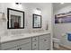 Modern bathroom with double sink vanity, neutral paint, and tiled floors at 7539 Hagemeyer Pl, The Villages, FL 34762
