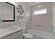 Clean bathroom featuring shower/tub combination, white countertops, and framed mirrors at 7539 Hagemeyer Pl, The Villages, FL 34762