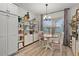 Cozy breakfast nook with built-in shelving and a view of the outside neighborhood at 7539 Hagemeyer Pl, The Villages, FL 34762