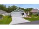 Charming single-story home with manicured landscaping, attached garage, and inviting curb appeal at 7539 Hagemeyer Pl, The Villages, FL 34762