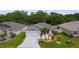 Charming single-story home with a two-car garage, well-maintained lawn, and attractive landscaping at 7539 Hagemeyer Pl, The Villages, FL 34762