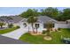Charming single-story home with a two-car garage, well-maintained lawn, and attractive landscaping at 7539 Hagemeyer Pl, The Villages, FL 34762