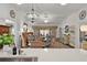Spacious living area boasting contemporary decor, luxury vinyl floors, and an abundance of natural light at 7539 Hagemeyer Pl, The Villages, FL 34762