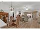 Bright living space features luxury vinyl flooring, stylish furnishings, and seamless indoor-outdoor flow at 7539 Hagemeyer Pl, The Villages, FL 34762