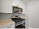 Updated kitchen with a gas range and microwave at 900 Maple Ave, Fruitland Park, FL 34731