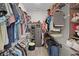 Walk-in closet features ample shelving and storage for all your wardrobe needs at 916 Carmillion Ct, Groveland, FL 34736