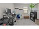 Office features two desks, shelves, and a window at 916 Carmillion Ct, Groveland, FL 34736