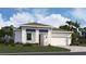 Charming single-story home featuring a two-car garage and welcoming front porch in a well-maintained community at 999 Fiesta Key Cir, Lady Lake, FL 32159