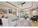 Open-concept dining area with modern lighting and views of the backyard at 10199 Mainsail Dr, Oxford, FL 34484
