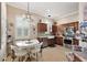 Charming kitchen with stainless steel appliances, wood cabinets, and a breakfast nook at 10199 Mainsail Dr, Oxford, FL 34484