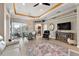 Open living space with dining area, backyard views, and stylish decor at 10199 Mainsail Dr, Oxford, FL 34484